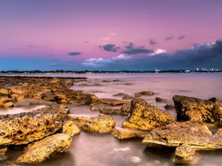 Darwin in the distance across the water during sunset 