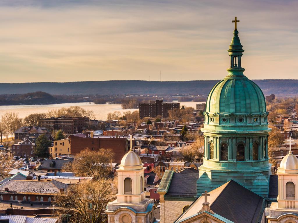 Harrisburg, Pennsylvania, USA with the Cathedral Parish of Saint Patrick seen from the South Street Parking Garage and the city beyond. 