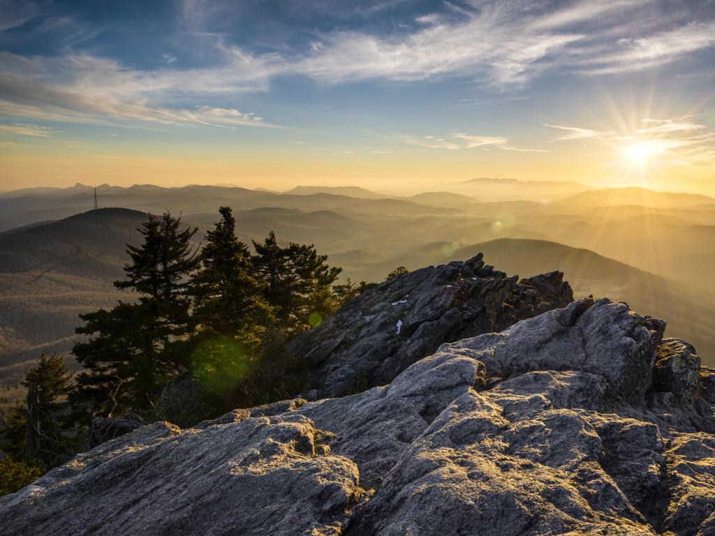 Sunset looking down over forested mountains