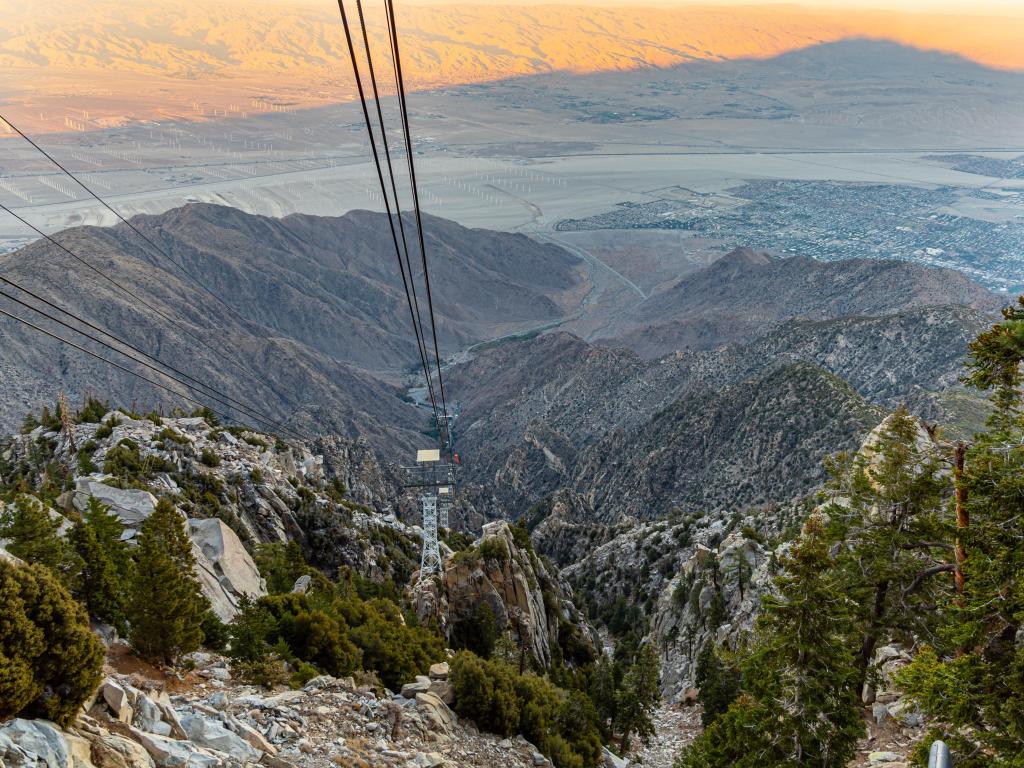 View from the top of Palm Springs Aerial Tramway with pastel-hued sunset light cast on the valley below