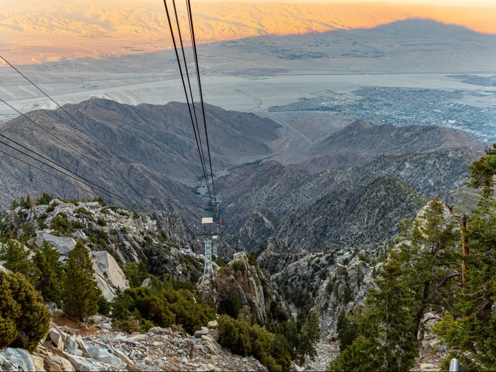 View from the top of Palm Springs Aerial Tramway with pastel-hued sunset light cast on the valley below