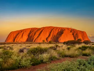 The iconic sandstone rock during an orange-blue sunset