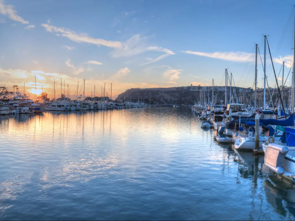 Sunset over sailboats in Dana Point harbor in the fall