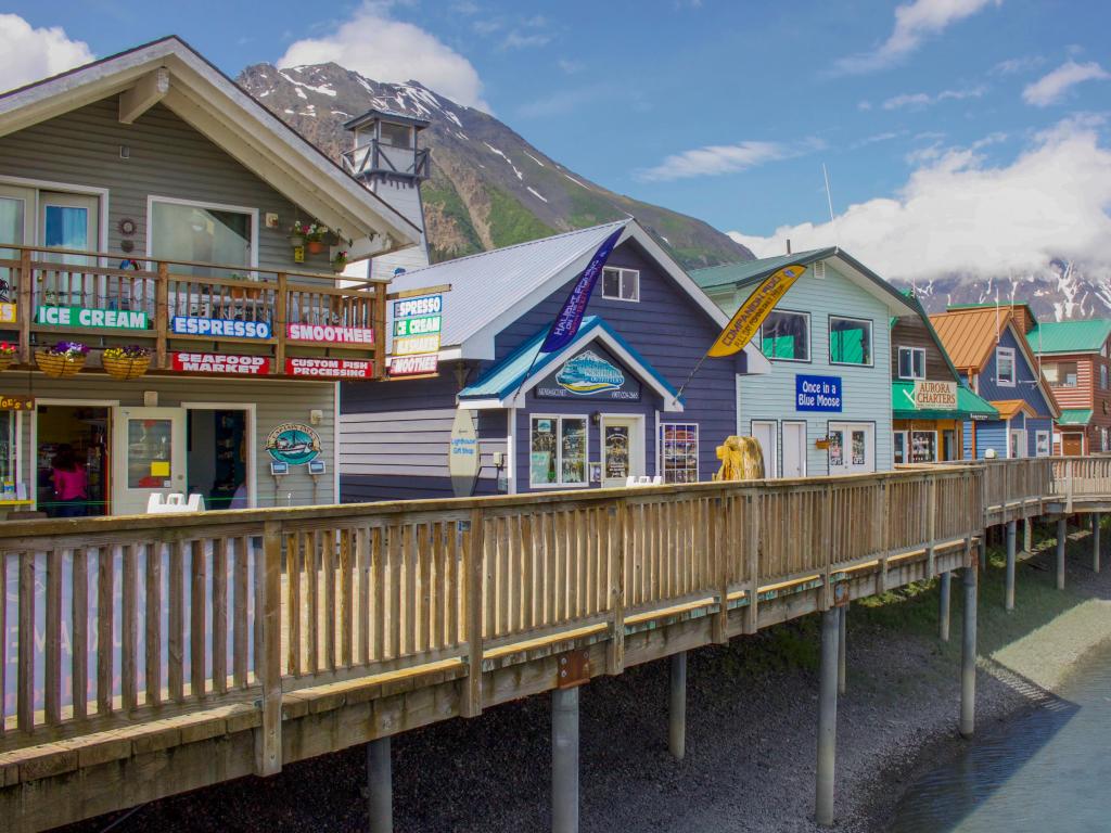 Colorful shops line the dock in Seward Harbor in Resurrection Bay, Alaska