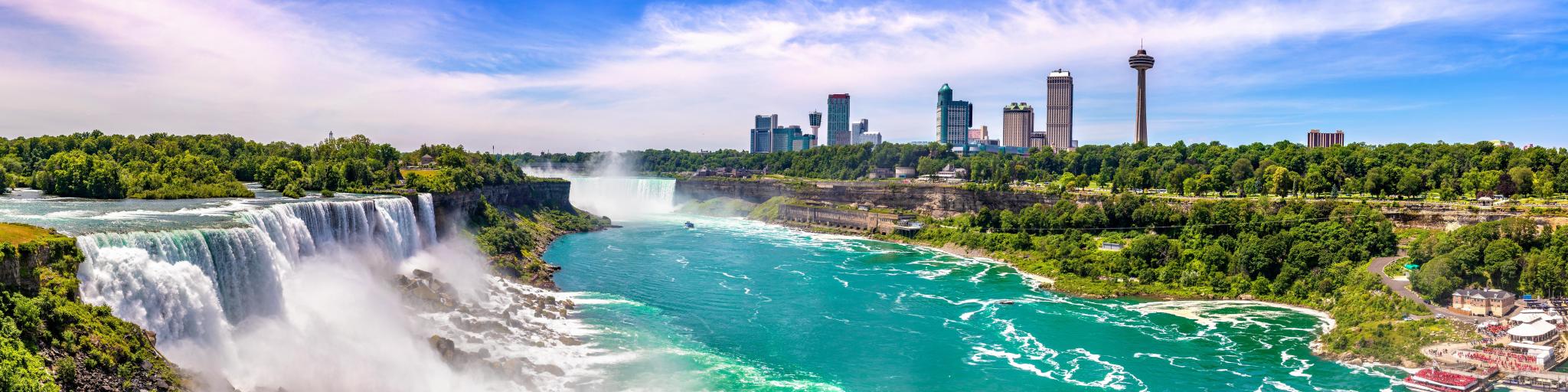 Niagara Falls, USA taken as a panorama view of the falls from the American side on a sunny day.