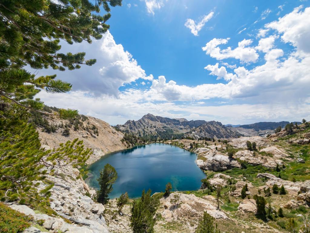 Clear waters at Liberty Lake, Nevada, at Ruby Mountain, with trees dotted around