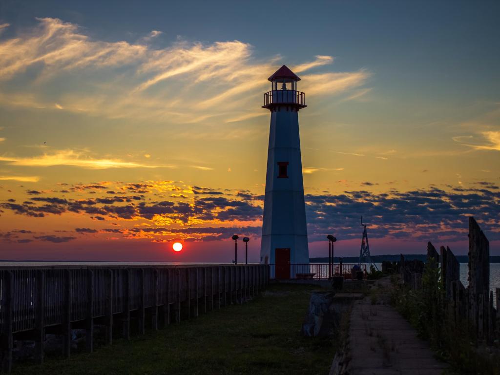 Sunrise along the St. Ignace boardwalk with the Wawatam Lighthouse in the middle of the image
