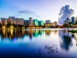 Orlando, USA with the downtown city at twilight, the still water in the foreground reflecting the skyscrapers. 