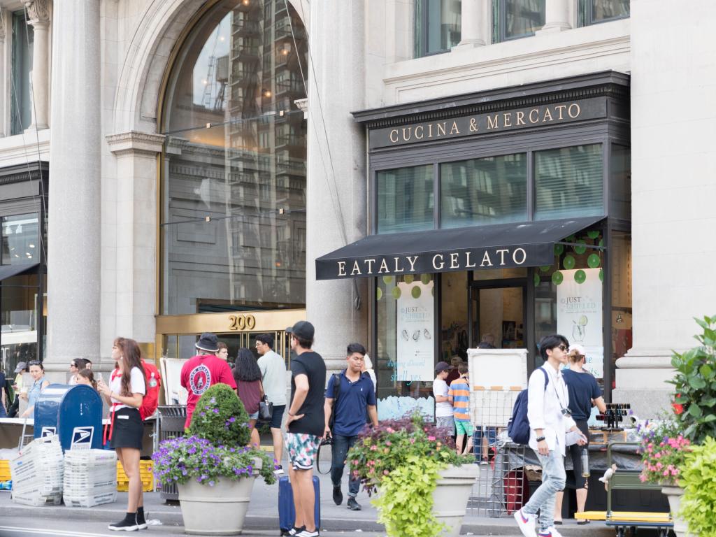 People walking past the outside of an Eataly Gelato store, New York