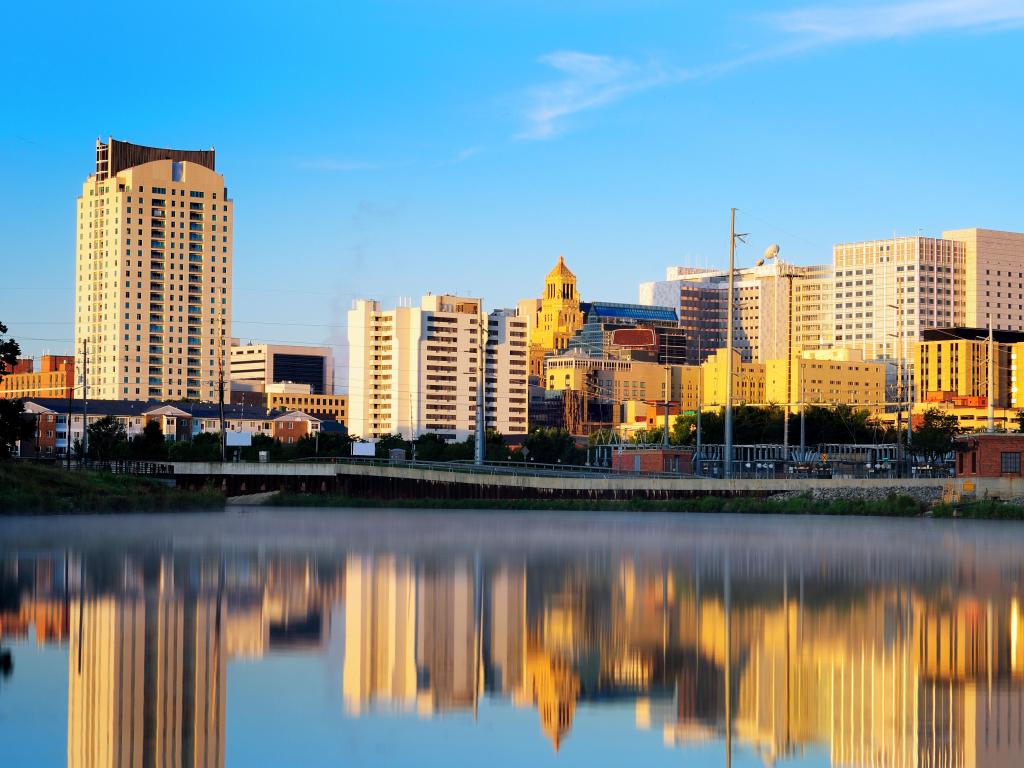 Rochester, Minnesota, USA with the city skyline in the distance and the river in the foreground taken on a sunny day.