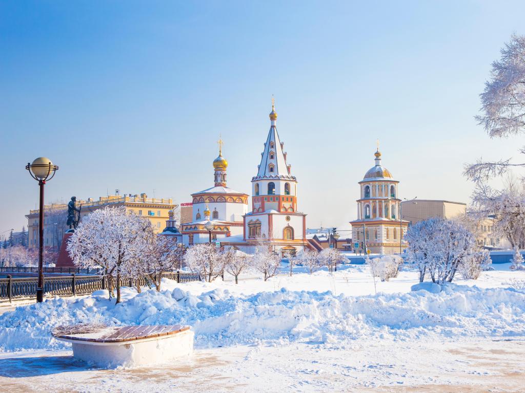 Landscape of Irkutsk city of Russia during winter season, with church and tree covered by snow.