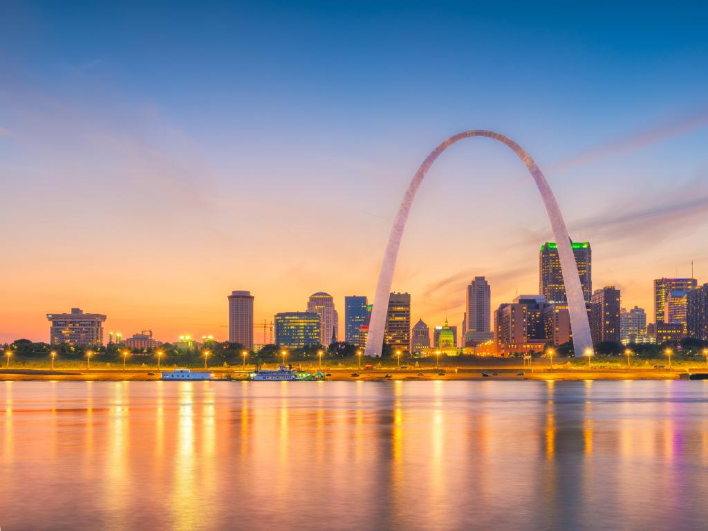 St. Louis, Missouri, USA taken with the downtown cityscape with the arch on the Mississippi River at dusk.