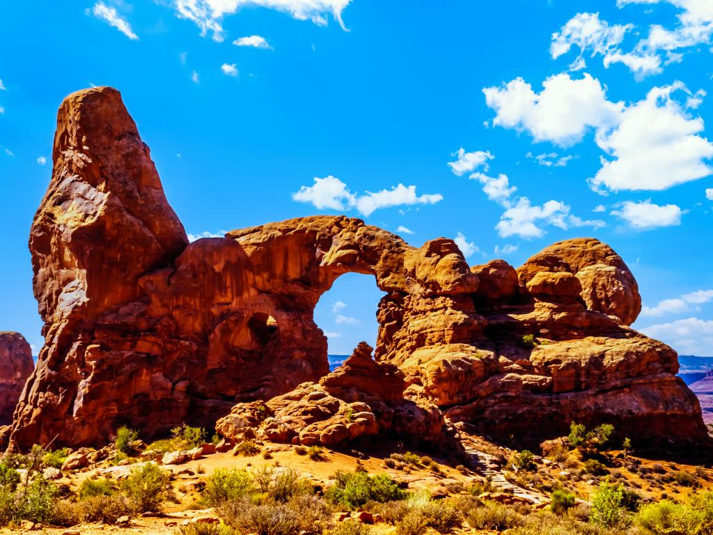 A sunny morning in the Arches National Park with one of the large Sandstone Arches, the Turret Arch in Utah