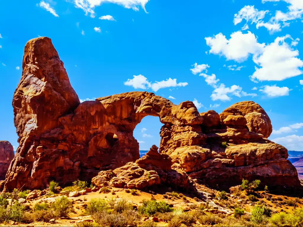 A sunny morning in the Arches National Park with one of the large Sandstone Arches, the Turret Arch in Utah