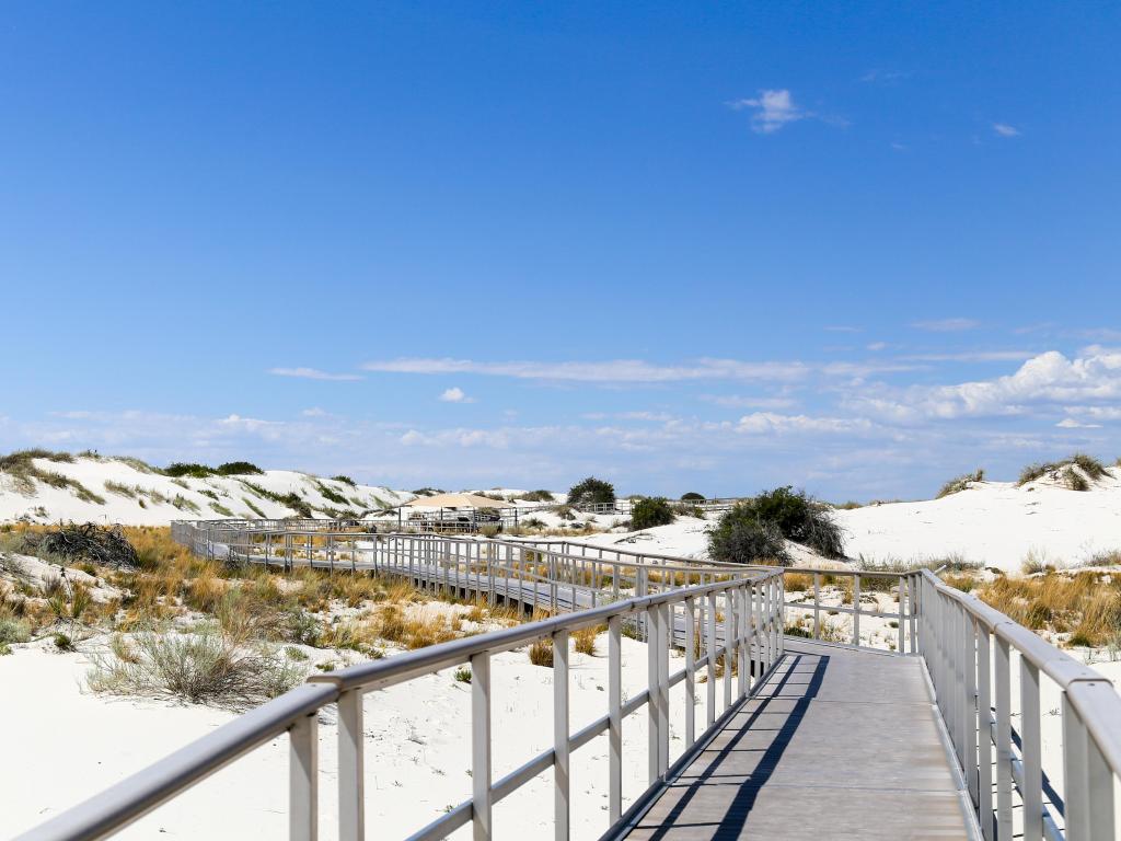 White Sands National Monument, New Mexico, USA taken at an inter-dune boardwalk inside the White Sands National Monument on a sunny day.