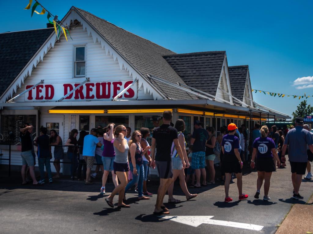 People queueing on a sunny day outside Ted Drewes frozen custard and ice cream shop on Old Route 66, St Louis