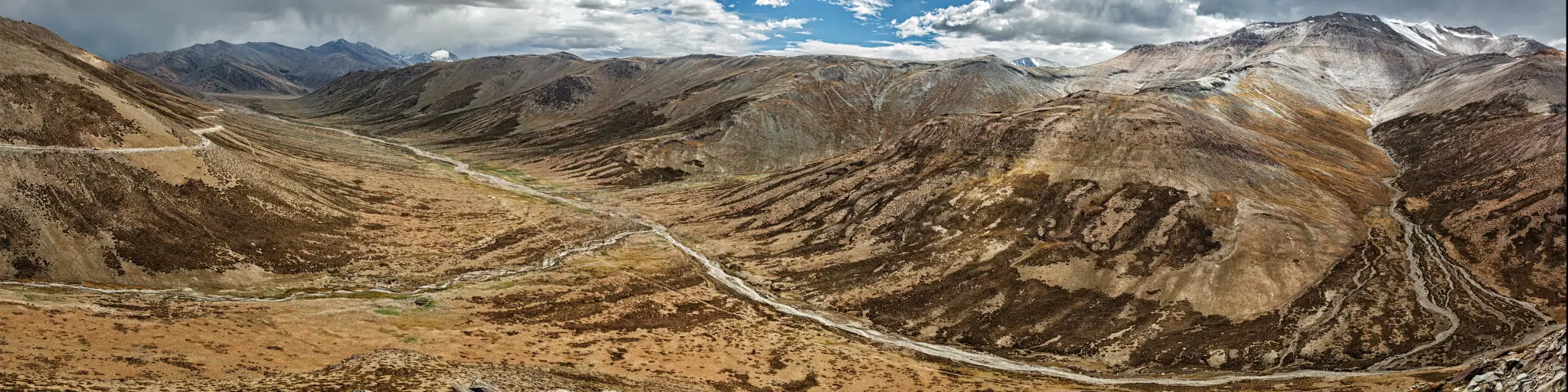The dramatic landscape of one of the highest roads in the world - the Tangla La pass in the Ladakh region of Kashmir, India