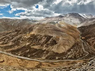 The dramatic landscape of one of the highest roads in the world - the Tangla La pass in the Ladakh region of Kashmir, India