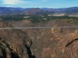 Panoramic view of the Royal Gorge Bridge, the largest suspension bridge in the USA, on a sunny day with blue sky above