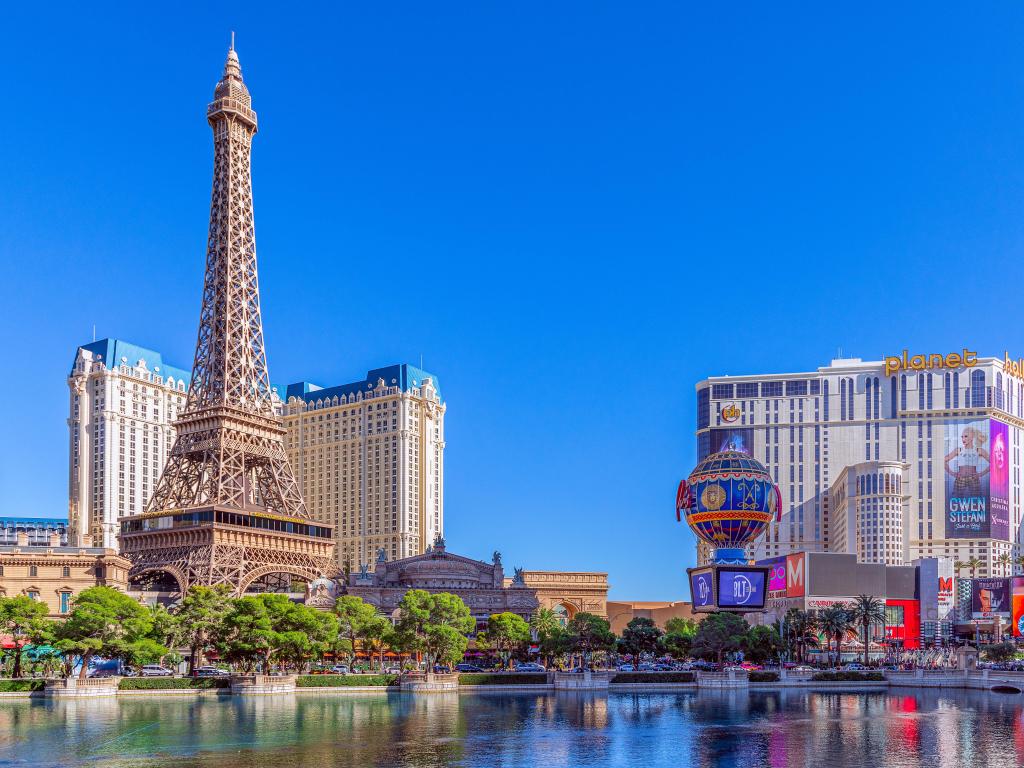 Las Vegas, Nevada, USA with a view of Paris Las Vegas Hotel (Replica of Eiffel Tower in Paris) and Hotel Planet Hollywood on a sunny day.