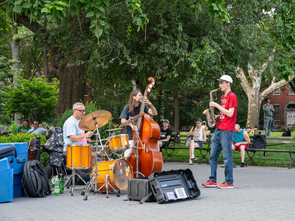 A three men jazz band, playing in the Washington square park.