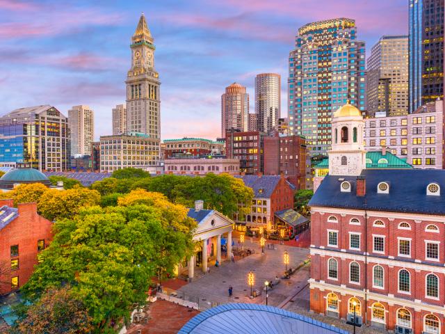 Downtown Boston with the Faneuil Hall and Quincy Market at dusk.