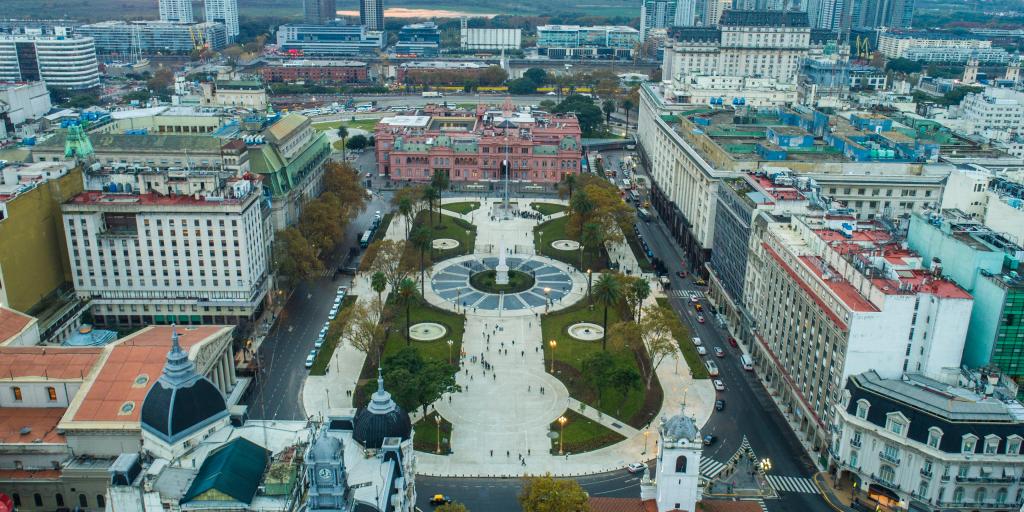  Aerial view of the Plaza de Mayo in Buenos Aires, Argentina, with the paved area and May monument in the middle, and large colonial buildings around the outside of it