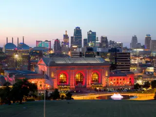 Nigh view of Kansas City with historic building lit up in red