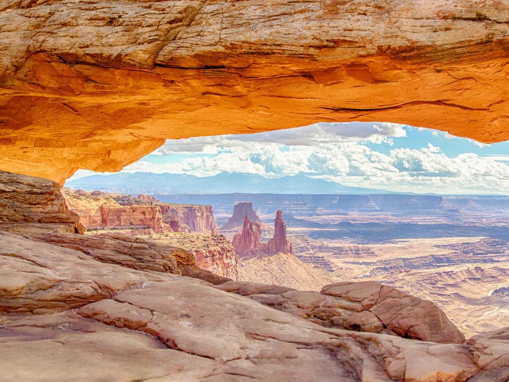 Panoramic view of famous Mesa Arch, iconic symbol of the American West in the beautiful morning light