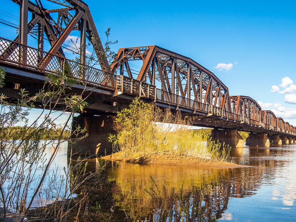 Prince George, British Columbia Canada Railway bridge over the Fraser River on a sunny day.