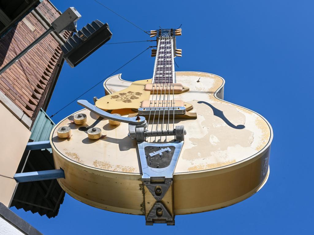 View from below of the guitar statue sign outside legendary Sun Studio in Memphis