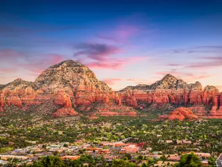 Sedona, Arizona, USA downtown and mountains at sunset.