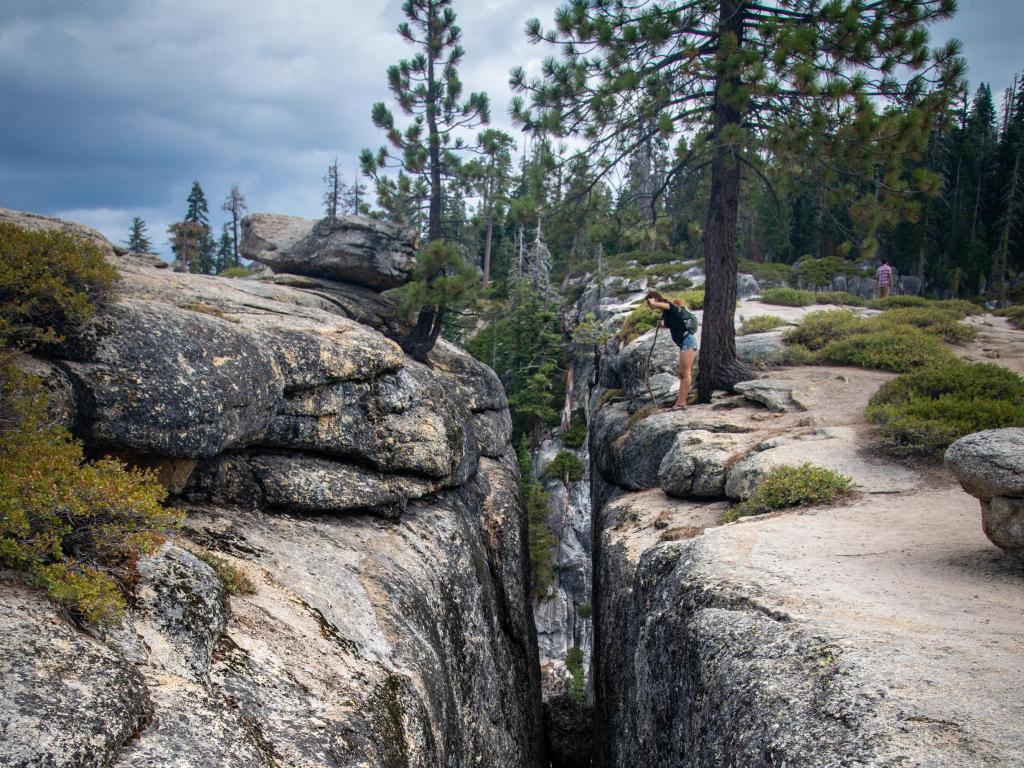 Deep fissure with stones sitting within it, at Taft Point, Yosemite