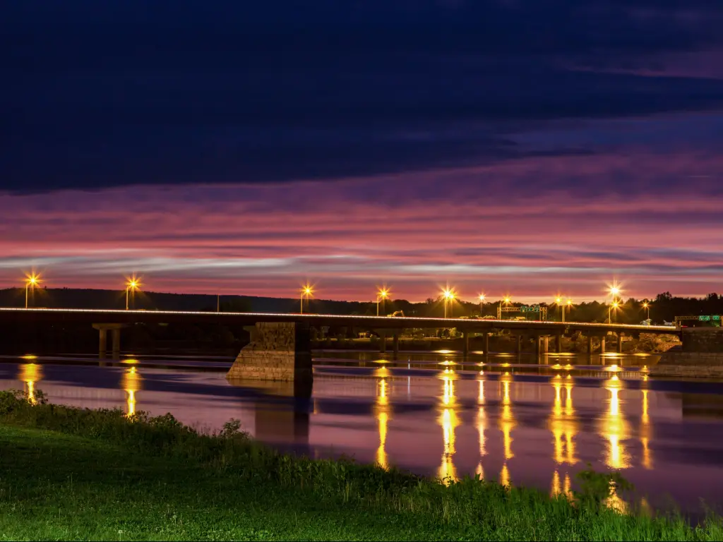 Fredericton, New Brunswick, Canada with a bridge in Fredericton taken at night.
