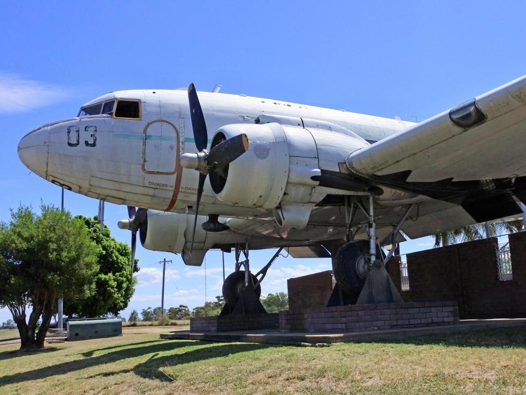 Old plane, now a tourist attraction, on a sunny day with blue sky