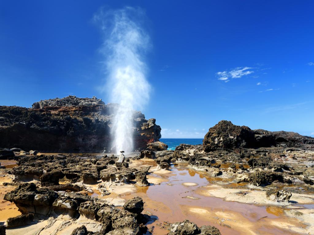 A jet of water spurts out of the Nakalele Blowhole on the Maui coastline, Hawaii