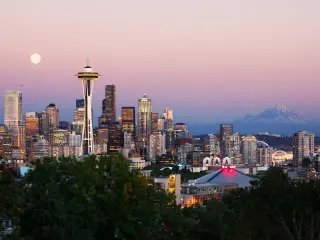 Seattle skyline at dusk with Mt Rainier in the background
