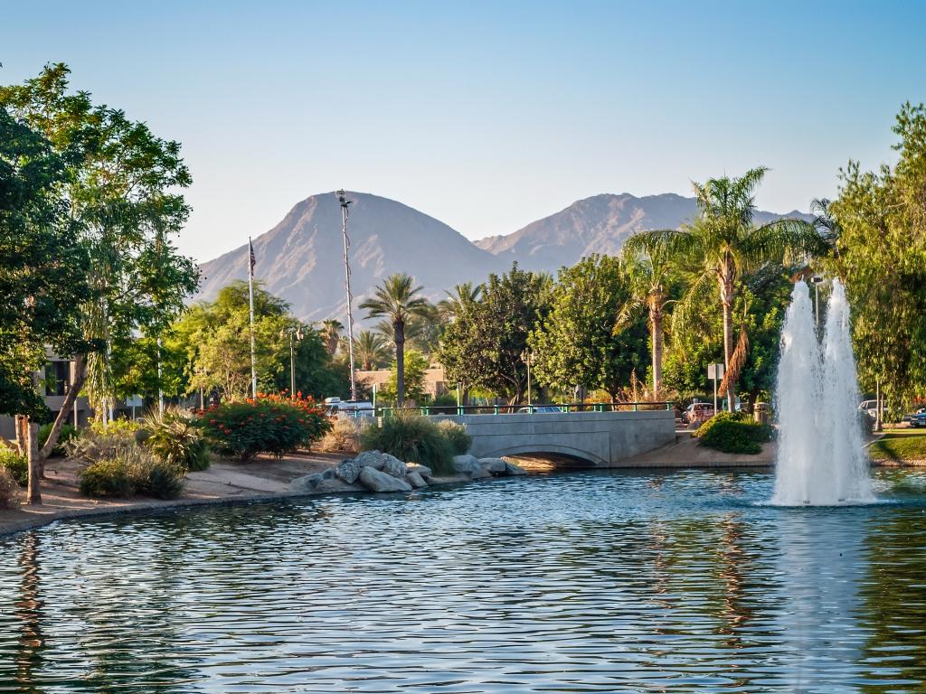 A park with palm trees and a fountain in Palm Springs, California