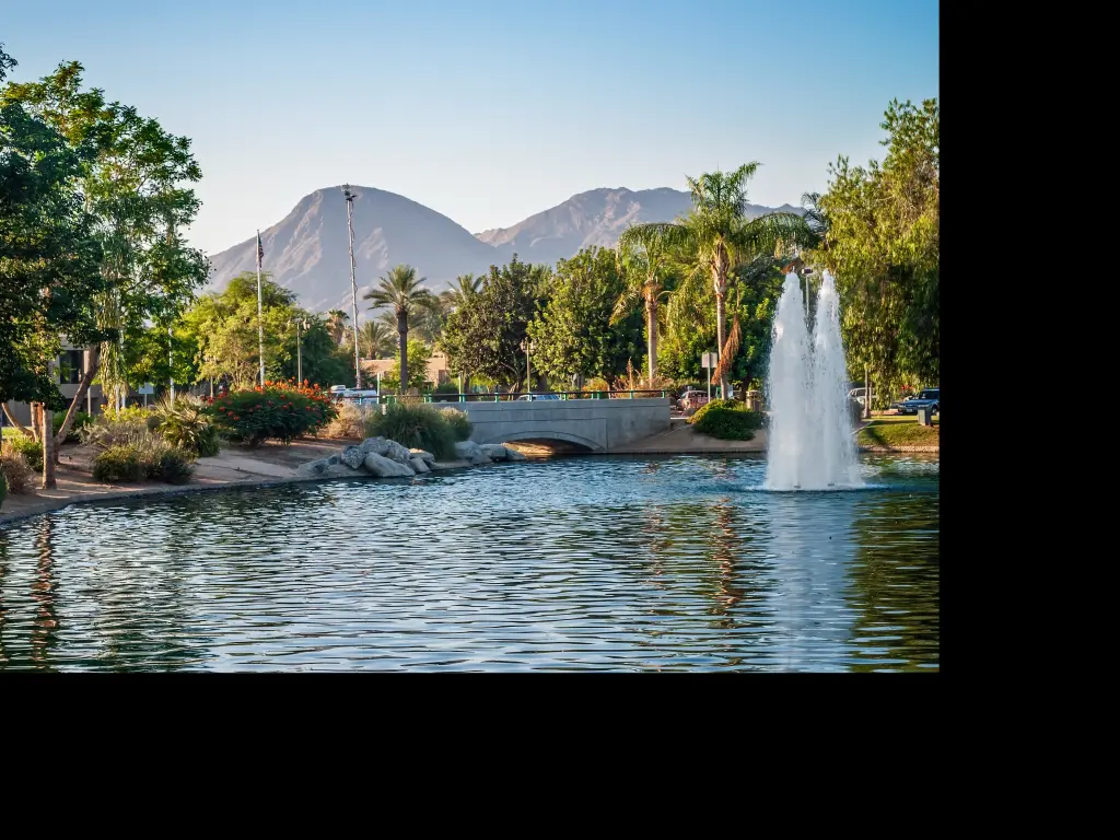 A park with palm trees and a fountain in Palm Springs, California