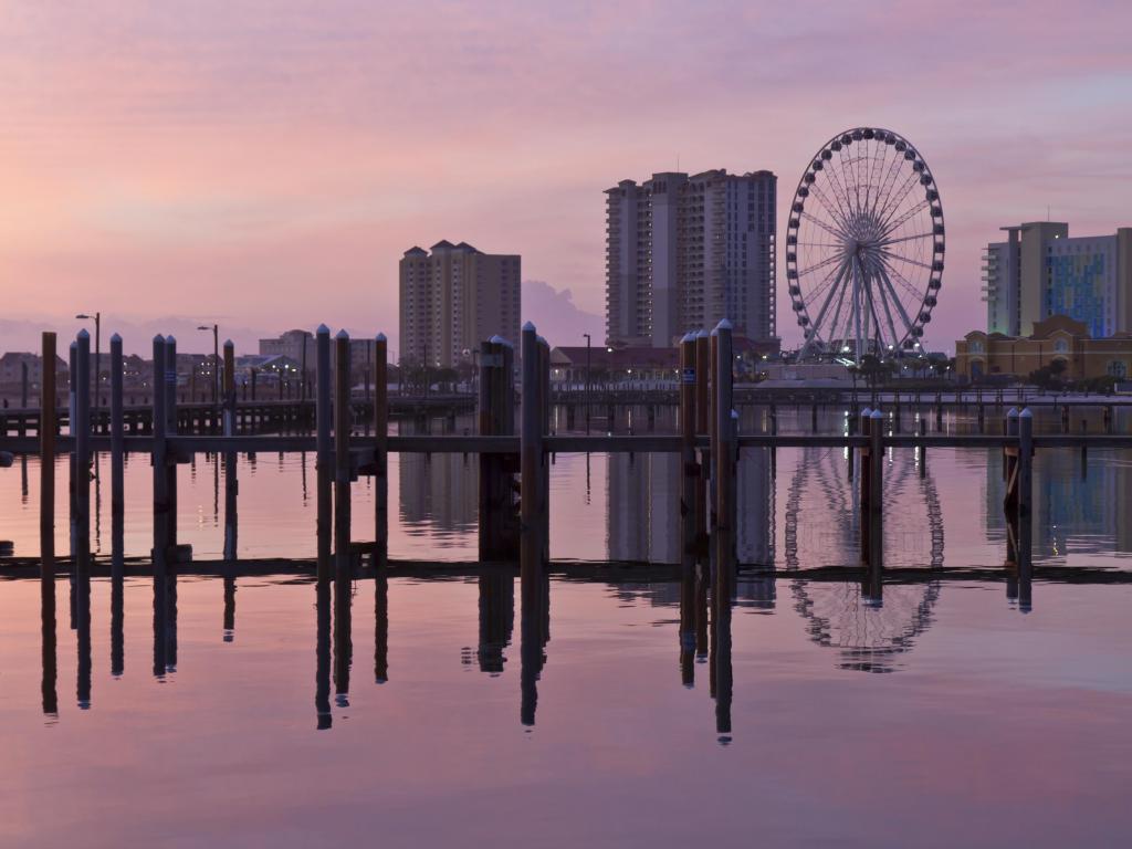 Sunrise on the Pensacola Beach Ferris wheel on Santa Rosa Sound in Pensacola Beach, Florida.