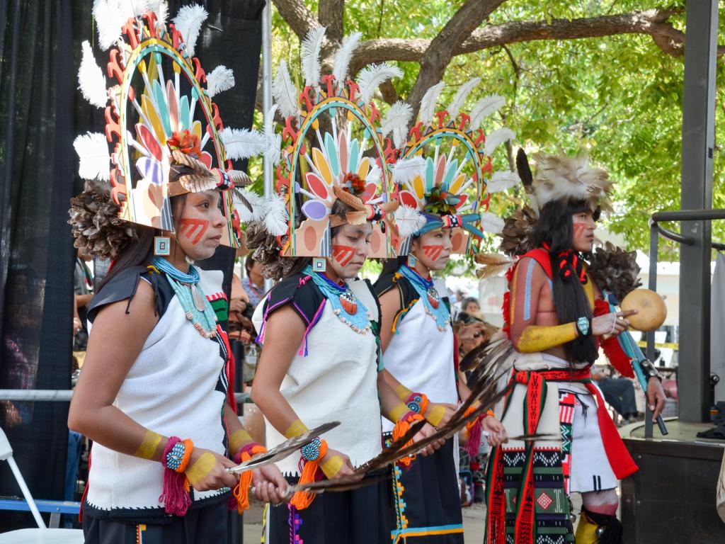 Decorative Hopi musicians and dancers lined up at Santa Fe Indian Market on the Santa Fe Plaza 