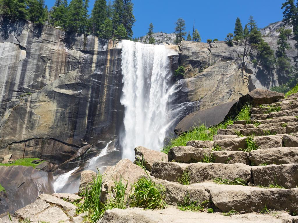 Vernal Falls as viewed from the stone steps of Mist Trail, sunny day