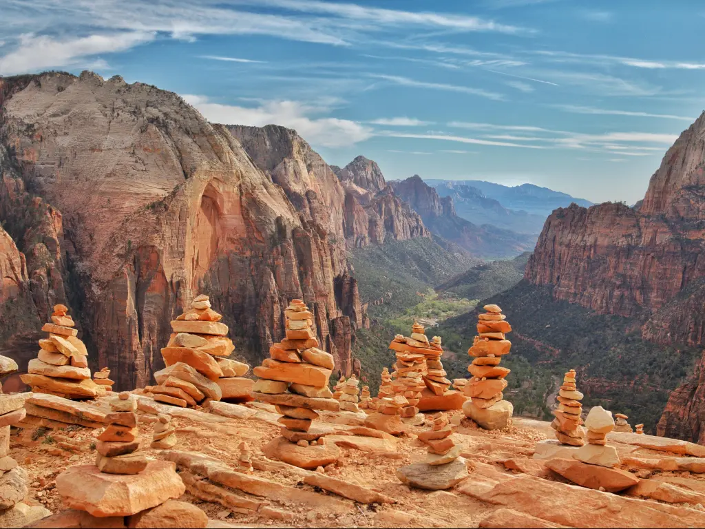 Stacks of rocks on a ledge above a deep wide valley 