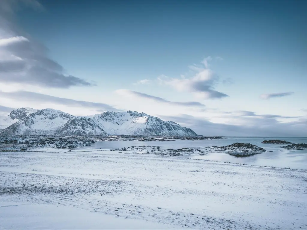 Chukotka region, Russia with a winter arctic landscape. Snow-covered tundra. Snowy ground surface. Cold frosty winter weather. The harsh climate of the polar region. Endless arctic desert.