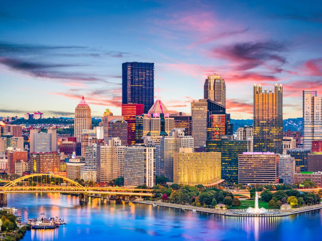Pittsburgh, Pennsylvania, USA downtown city skyline on the rivers at dusk.