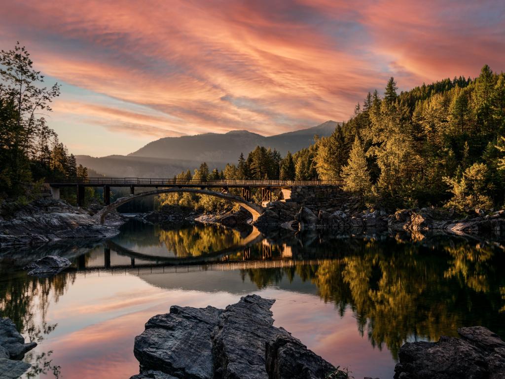 A sunrise across Belton Bridge over Middle Fork Flathead River near West Glacier in Glacier National Park, Montana.