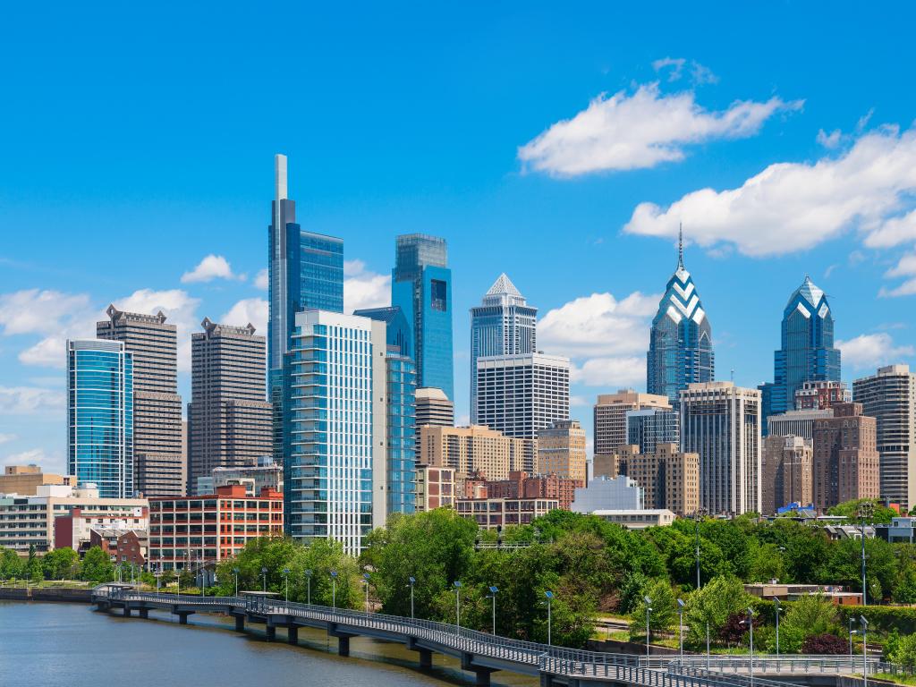 Philadelphia downtown skyline with blue sky and white clouds.