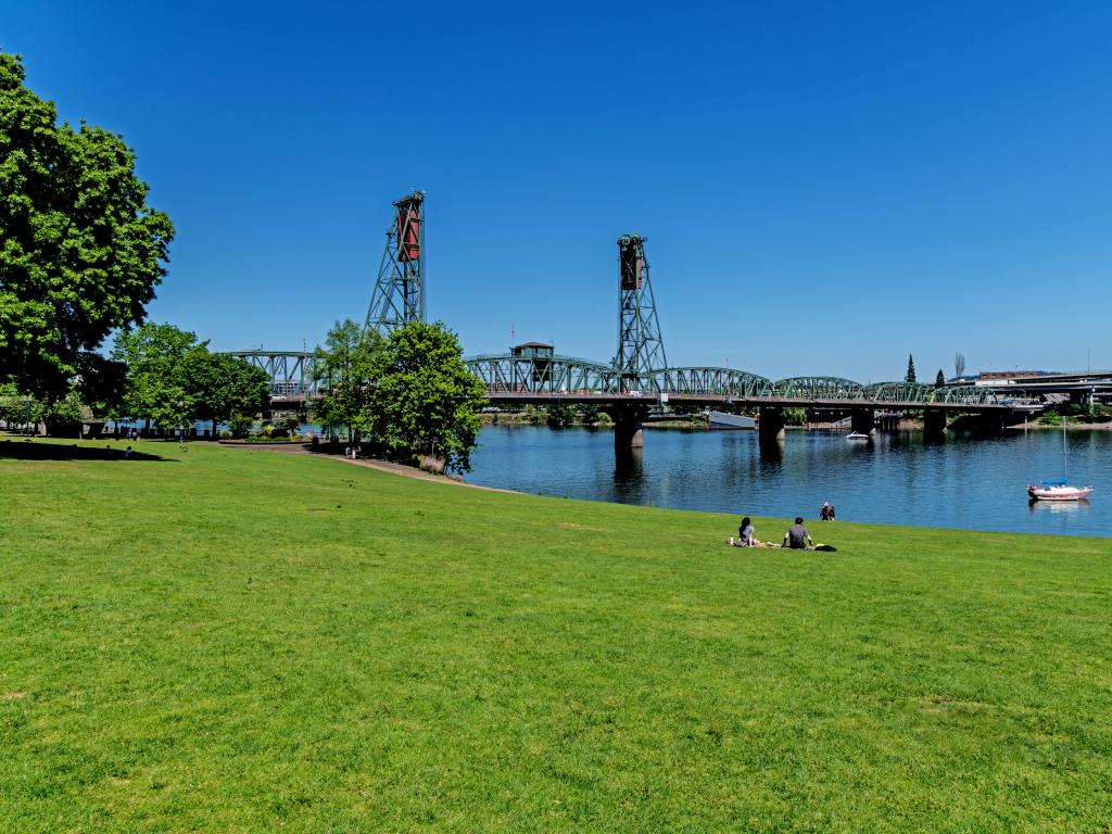 Tom McCall Waterfront Park and the Hawthorne Bridge on the Willamette River in Portland, Oregon