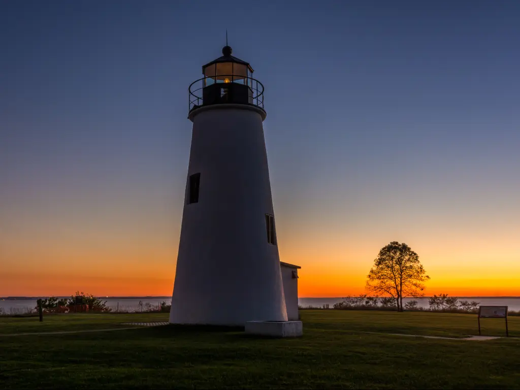 Turkey Point Lighthouse near  with the shore and the beautiful sunset at the back at  Elk Neck State Park, Maryland