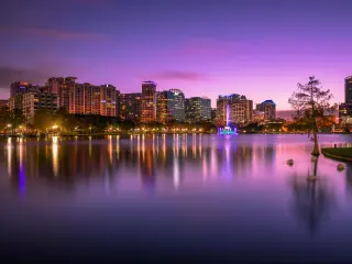 Colorful sunset above Lake Eola and city skyline in Orlando, Florida, USA